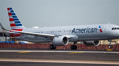 american airlines a321neo taking off for transcontinental flight from los angeles