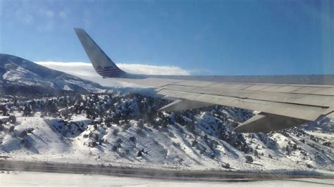 American Airlines aircraft approaching Vail mountain airport winter scenery