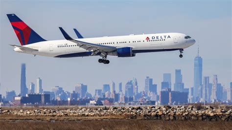 American Airlines aircraft taxiing with U.S. Capitol building in background