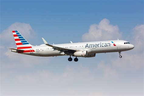 American Airlines aircraft with flight crew boarding at PHL gate area