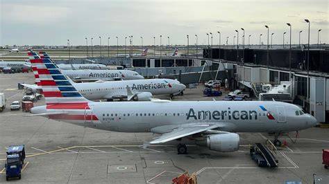 American Airlines and Delta aircraft at busy Florida airport gates