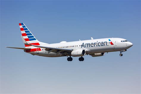 American Airlines Boeing aircraft at Dallas Fort Worth airport boarding Canada flight
