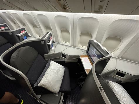 American Airlines Business Class cabin on Boeing 777 with mood lighting