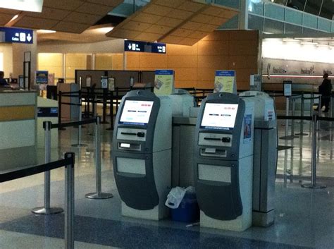 American Airlines check-in kiosks with passengers in queue, representing data collection without consent