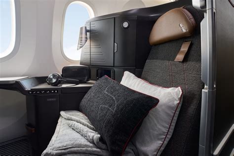 American Airlines Flagship Suite passengers enjoying inflight wine service