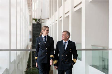american airlines pilot walking through terminal to crew lounge