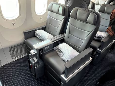 American Airlines premium economy cabin seat legrest large screen inflight entertainment