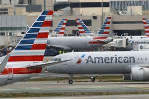 American Airlines summer travel crowds airport terminal boarding gates peak season operations