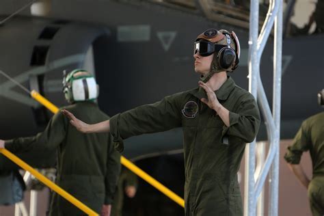american airlines technician conducting final safety checks before departure