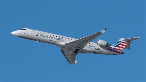American Eagle CRJ700 aircraft on regional airport tarmac
