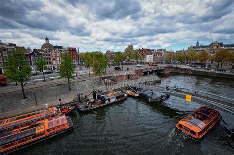 amsterdam canal near centraal station viewed after transport from schiphol airport