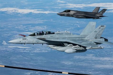 AN/ALQ-249 Next Generation Jammer pod mounted on EA-18G Growler during pre-mission checks aboard carrier strike group