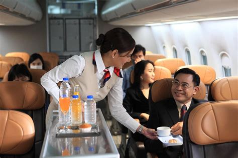 ANA All Nippon Airways cabin crew providing service with a smile