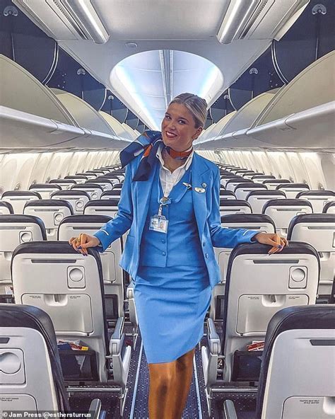 ANA flight attendant politely assisting a passenger on board