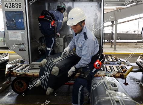 ANA ground crew bowing after aircraft pushback at Narita Airport