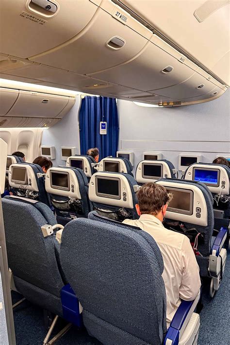 ANA Premium Economy seating with in-flight meal and entertainment display