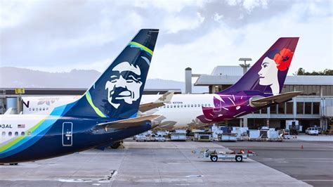 Anchorage cargo terminal with Hawaiian Airlines A330 offloading freight crates destined for Seattle