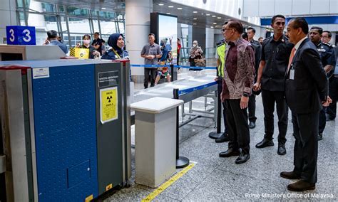 angry passenger confronting airline staff at a check-in counter