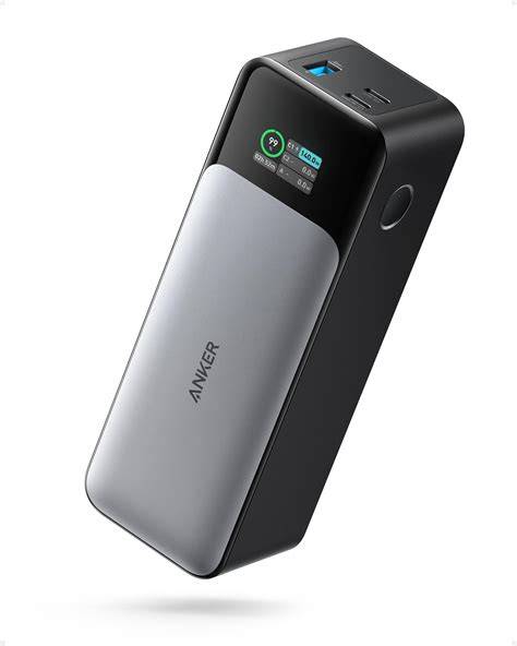 Anker 737 power bank next to a smartphone and a passport