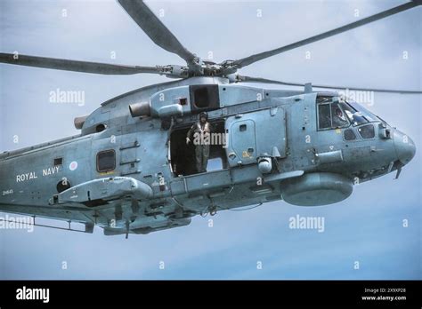 anti-submarine helicopter hovering over corvette deck in adriatic sea
