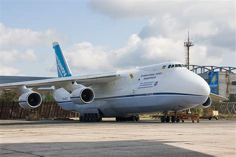 Antonov An-124 Ruslan strategic airlifter parked at an airport with its enormous cargo nose door open
