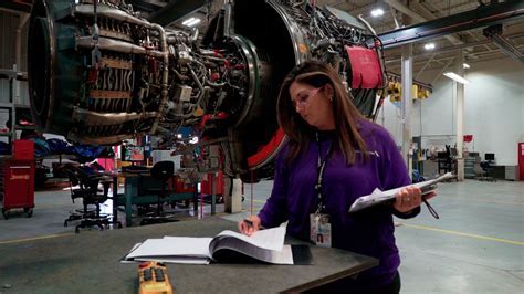 a&p mechanic inspecting boeing aircraft at tulsa base maintenance facility