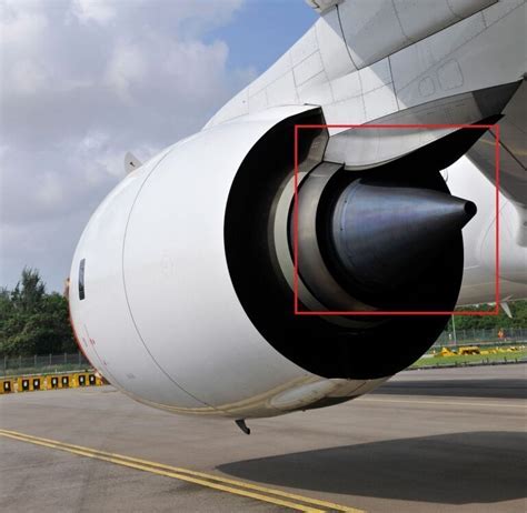 apu exhaust and intake ducts visible on aircraft parked on icy tarmac