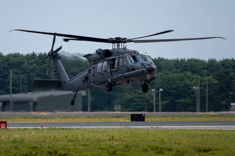 Arctic-based NATO personnel loading into HH-60W during exercise