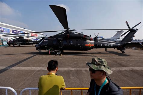 Armed Z-20 helicopter displaying TY-90 missile payload in readiness state
