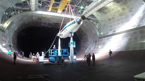Arnold Engineering wind tunnel with engineers preparing test equipment