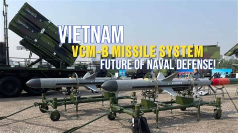 asean defense ministers viewing vietnamese vcm-b missile mockup at military expo