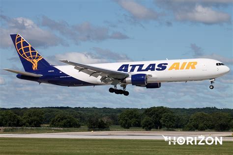 Atlas Air Boeing 767 cargo aircraft at ramp with loading equipment