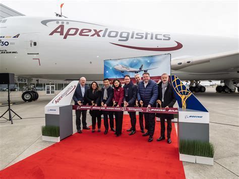 Atlas Air crew posing beside Boeing 747 at global logistics hub