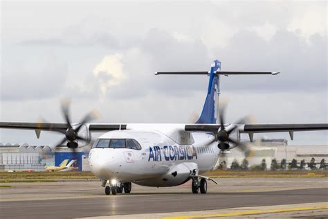 ATR 72-600 taxiing at regional airport under sunset lighting