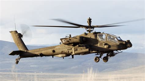 Australian and U.S. Army aviation officers reviewing AH-64E operational data
