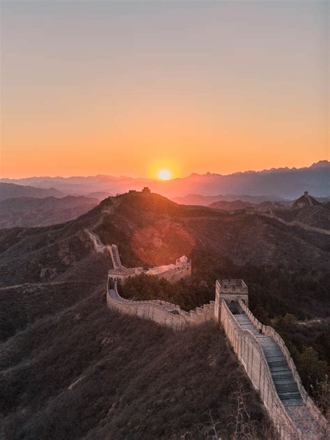 Australian tourists taking photos at the Great Wall of China at sunset