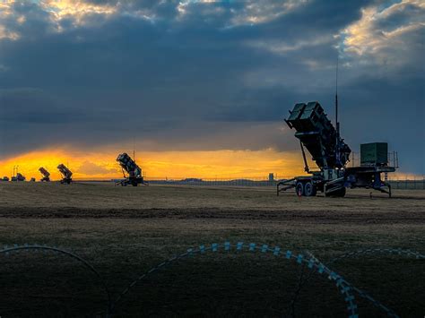 autonomous surveillance drones launching at sunset from DiaB stations