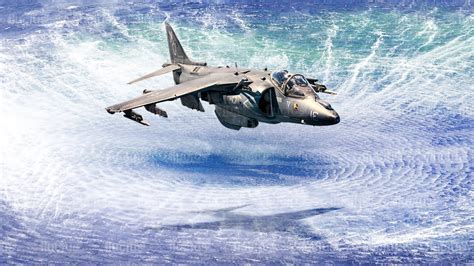 AV-8B Harrier II conducting vertical landing on amphibious assault ship