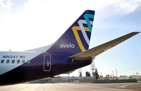 Avelo Airlines Boeing 737-800 aircraft in flight over clouds