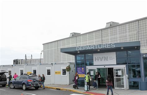 Avelo check-in counters bustling with passengers at Tweed New Haven Airport