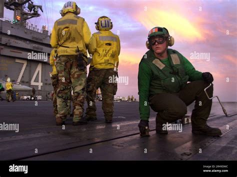 Aviation Boatswain Mate green jersey US Navy carrier flight deck