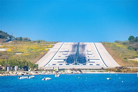 aviation enthusiast at fence during active takeoff at Skiathos Airport