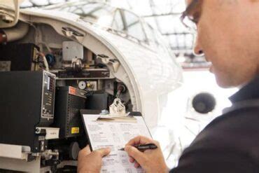 aviation maintenance engineer signing off on airframe inspection checklist