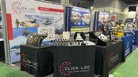 aviation mechanics at MRO Americas expo booth displaying aircraft components in Atlanta 2025