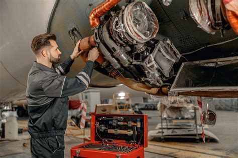 avionics technician performing ADS-B Out compliance upgrade during maintenance