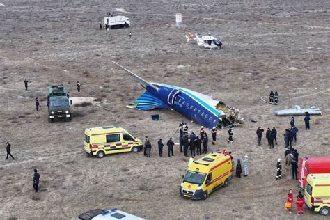 Azerbaijan Airlines aircraft surrounded by emergency vehicles on Kazakh runway