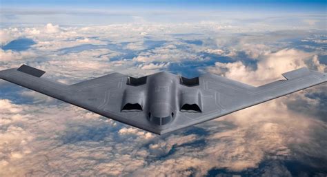b-2 spirit bomber flying low over mountainous terrain in combat readiness drill