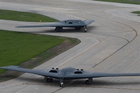 B-2 Spirit in flight with digital targeting network concept visualization