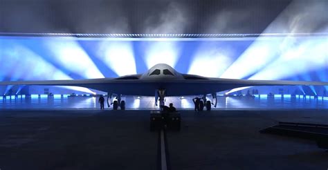 B-21 Raider stealth bomber parked outside modern military hangar