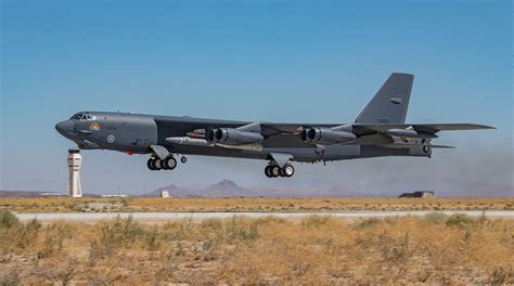 B-52H flying low over California mountains with LRSO test configuration